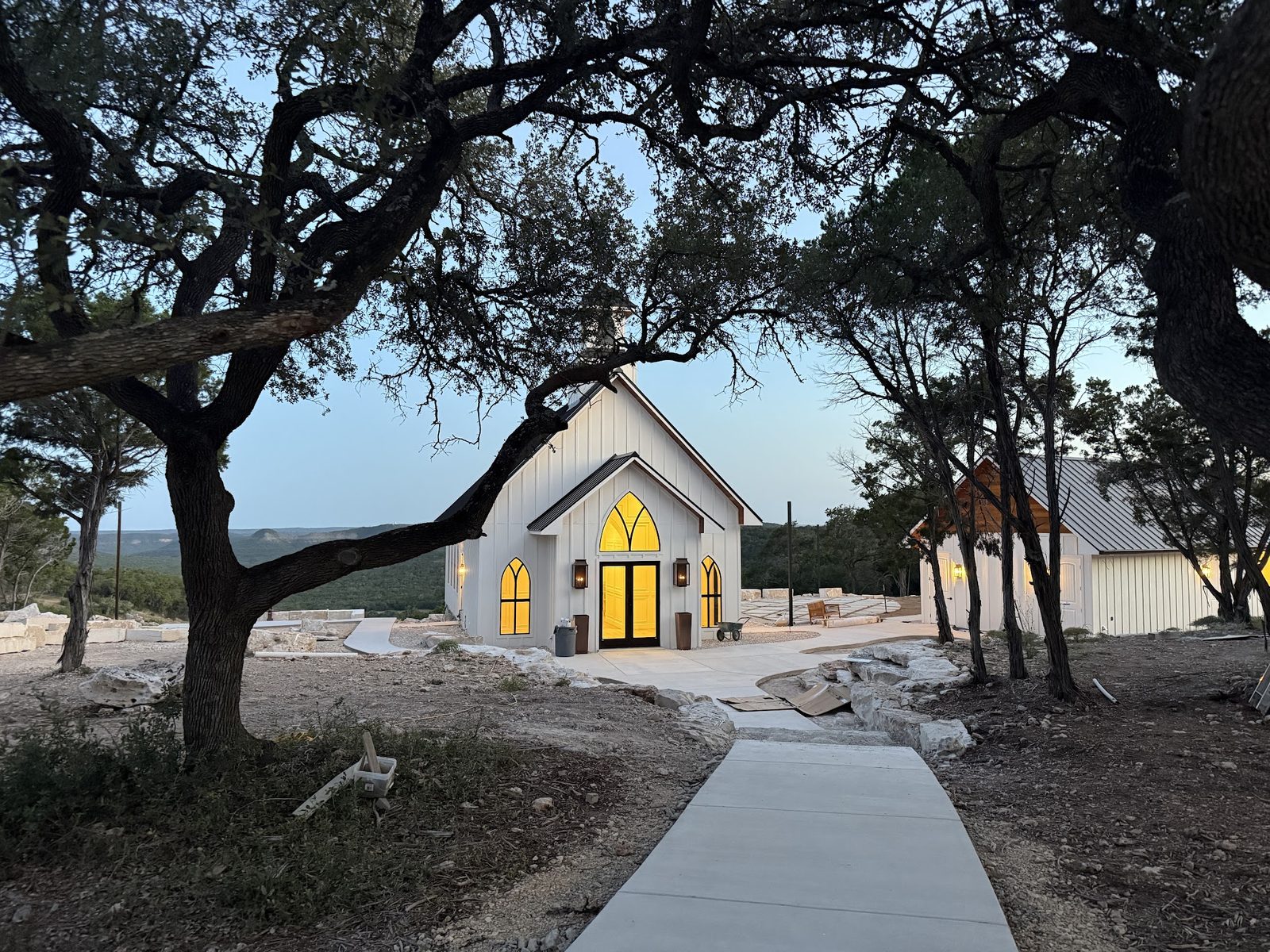 The Chapel at Wimberley, our sister venue, glowing at dusk in the Hill Country