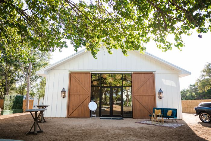 The reception hall with its barn doors open to the outdoor cocktail area
